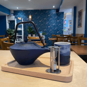Tea Tasting Table with Iron Teapot timer and cup